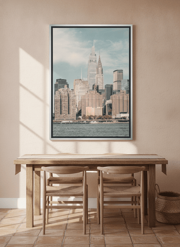 Canvas wall art with a silver leaf surround styled on the wall in a Mediterranean dining room