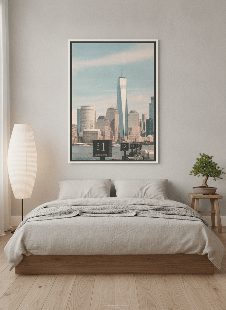 Canvas wall art with a white surround styled on the wall in a warm Japandi bedroom