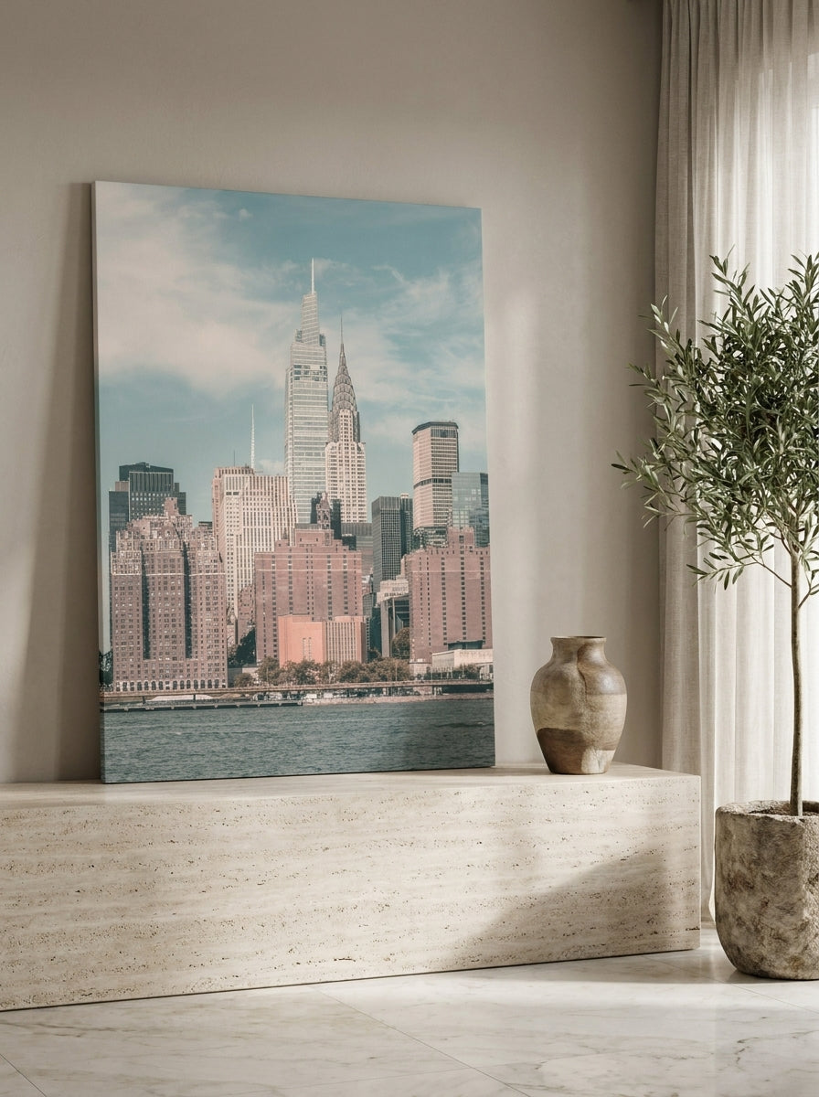 Stretched canvas wall art standing on a console in a luxe bedroom
