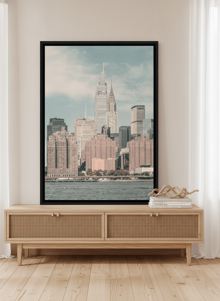Canvas wall art with a black surround standing on a sideboard in a coastal living room