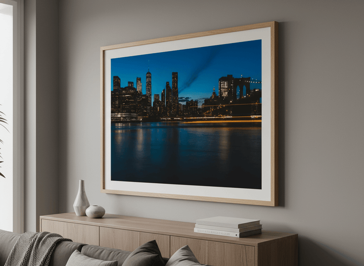 Modern wall art styled above a sofa in a neutral living room