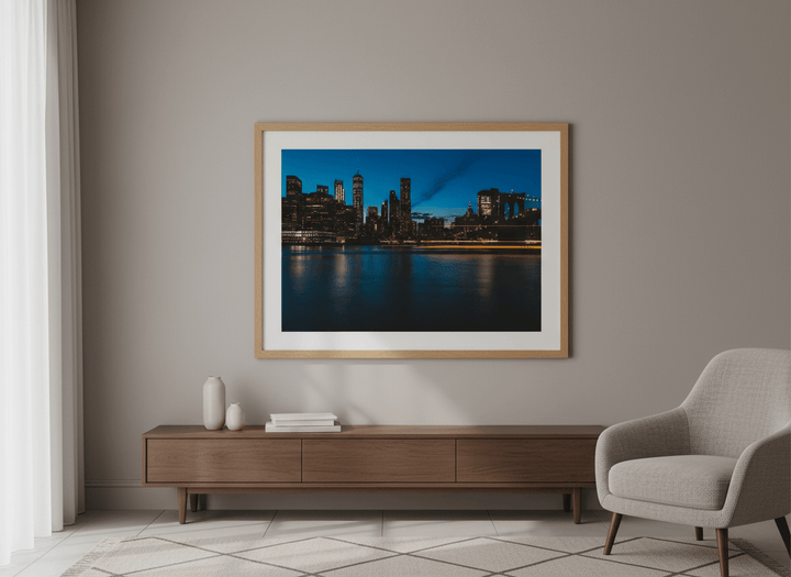 Modern wall art styled above a sofa in a neutral living room