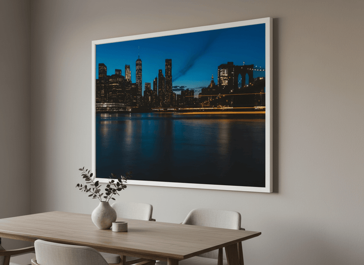 Wall art styled above a dining table in a contemporary home