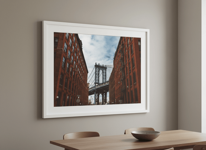 Wall art styled above a dining table in a contemporary home