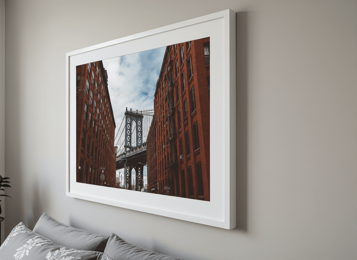 Minimalist artwork displayed in a calm, light-filled bedroom interior