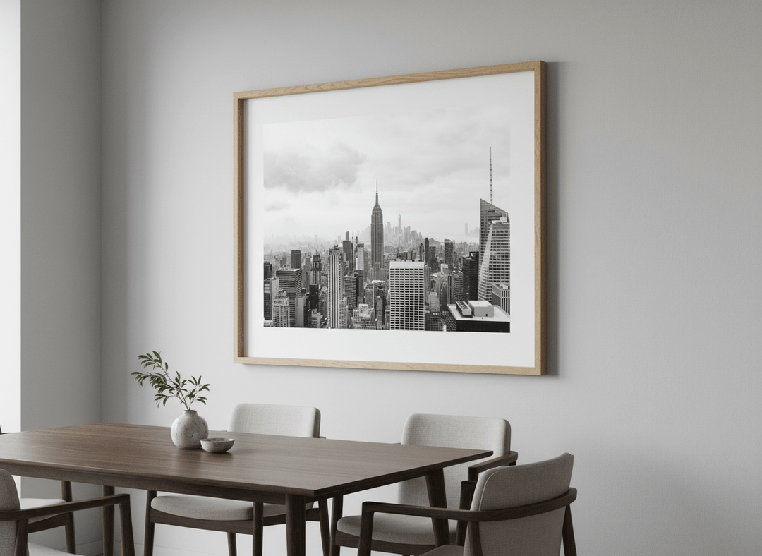 Wall art styled above a dining table in a contemporary home