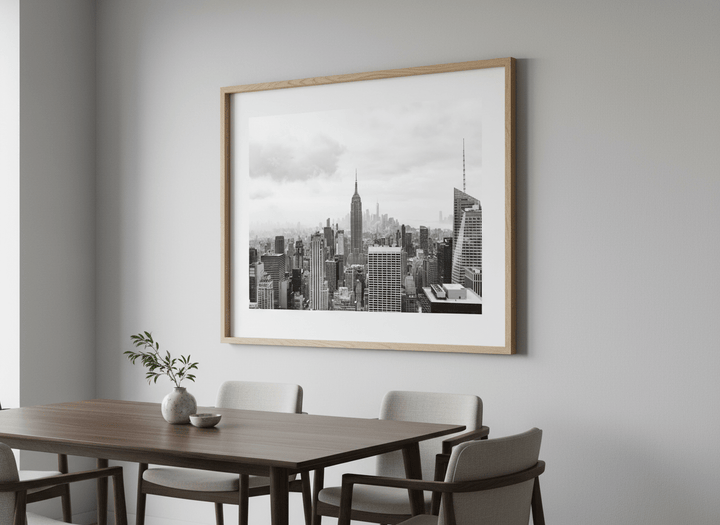 Wall art styled above a dining table in a contemporary home