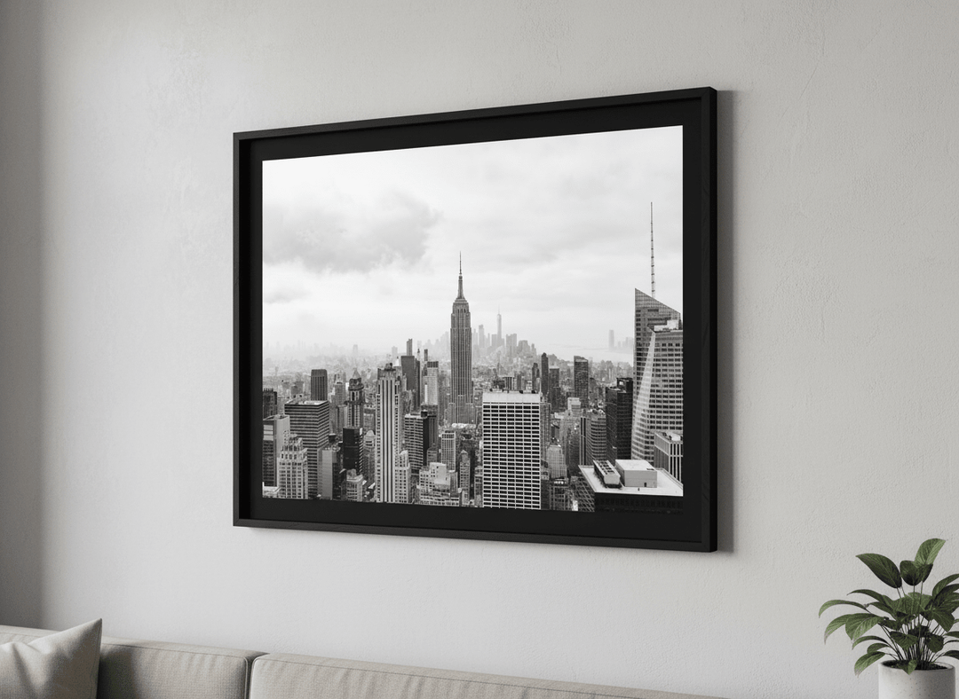 Modern wall art styled above a sofa in a neutral living room