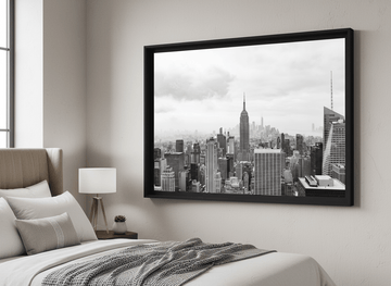 Minimalist artwork displayed in a calm, light-filled bedroom interior