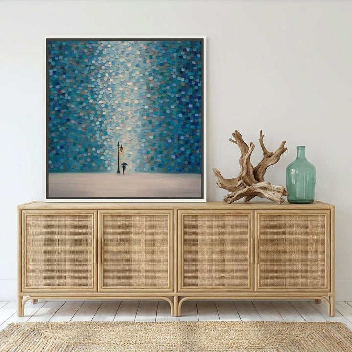 Canvas wall art with a white surround standing on a sideboard in a coastal dining room