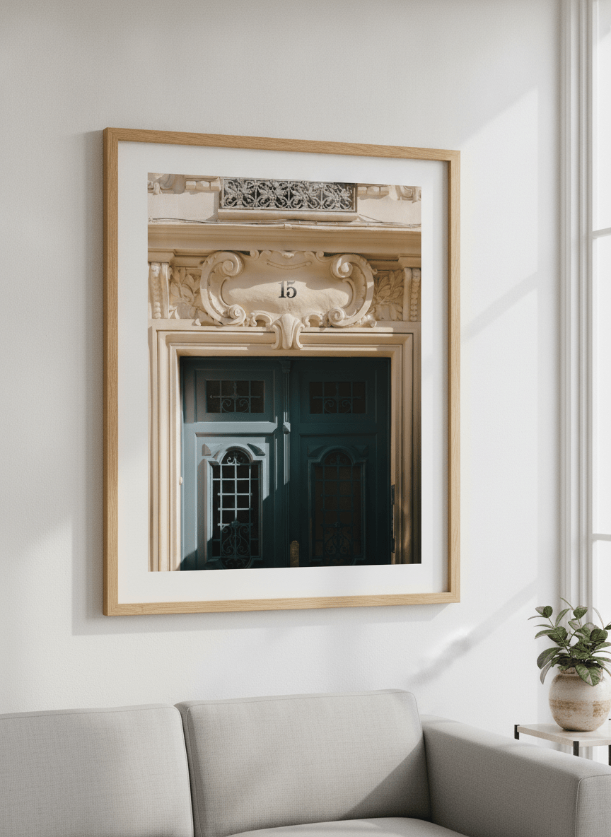 Modern wall art styled above a sofa in a neutral living room