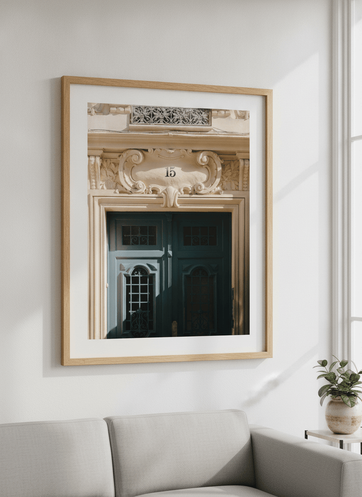 Modern wall art styled above a sofa in a neutral living room