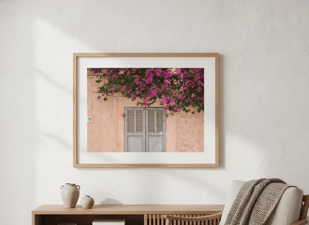 Modern wall art styled above a sofa in a neutral living room
