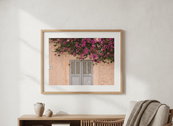 Modern wall art styled above a sofa in a neutral living room