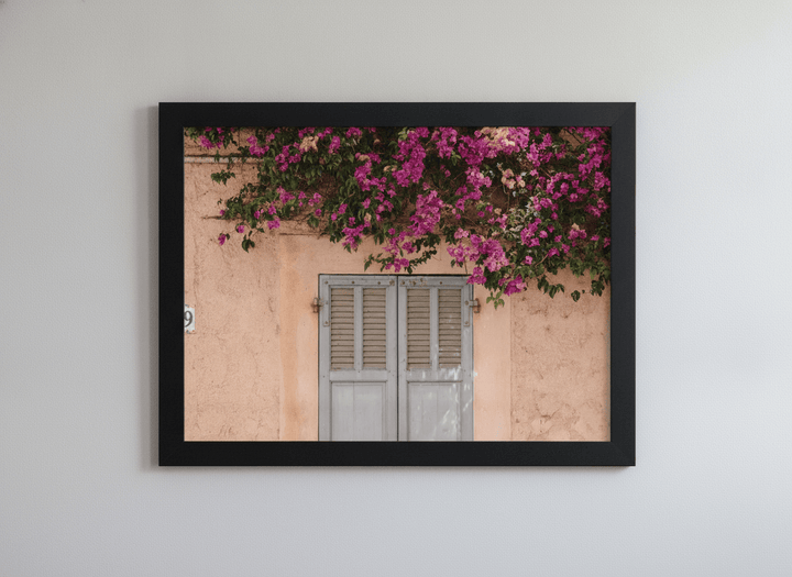Minimalist artwork displayed in a calm, light-filled bedroom interior