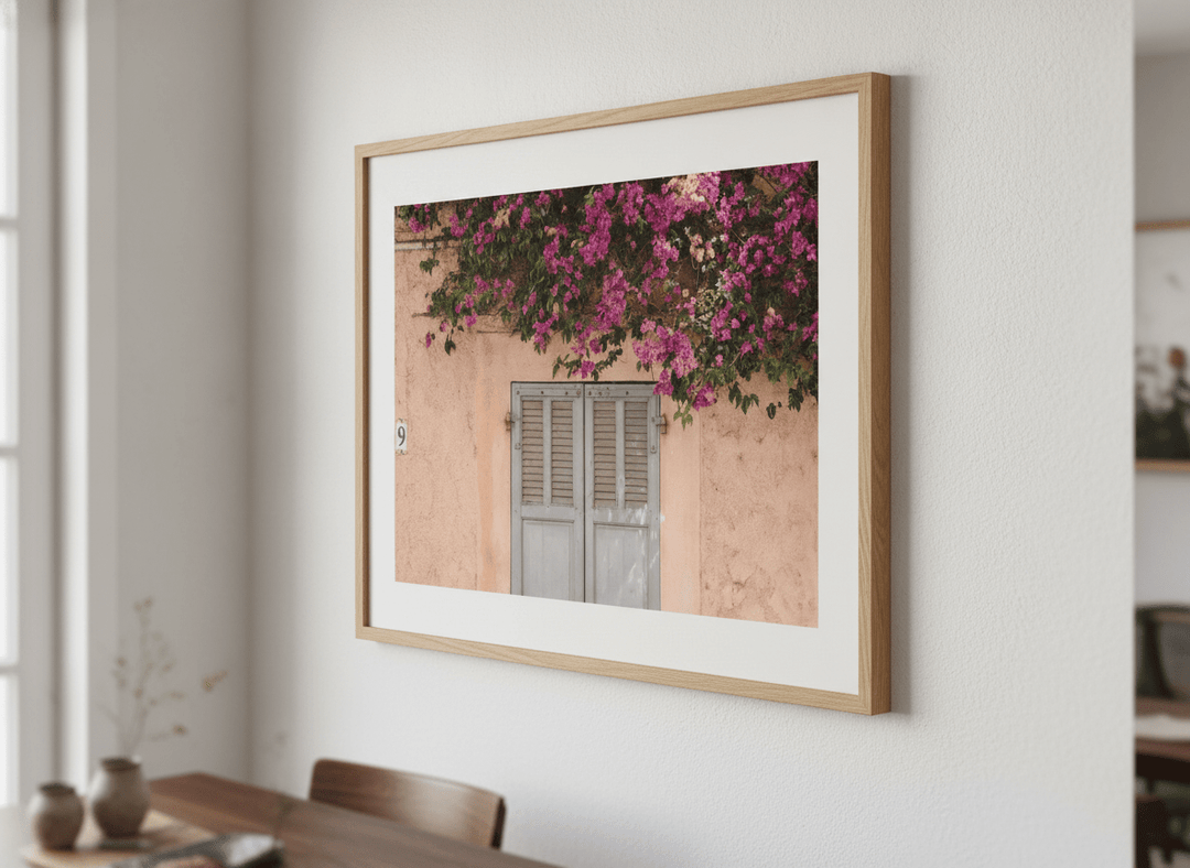 Wall art styled above a dining table in a contemporary home