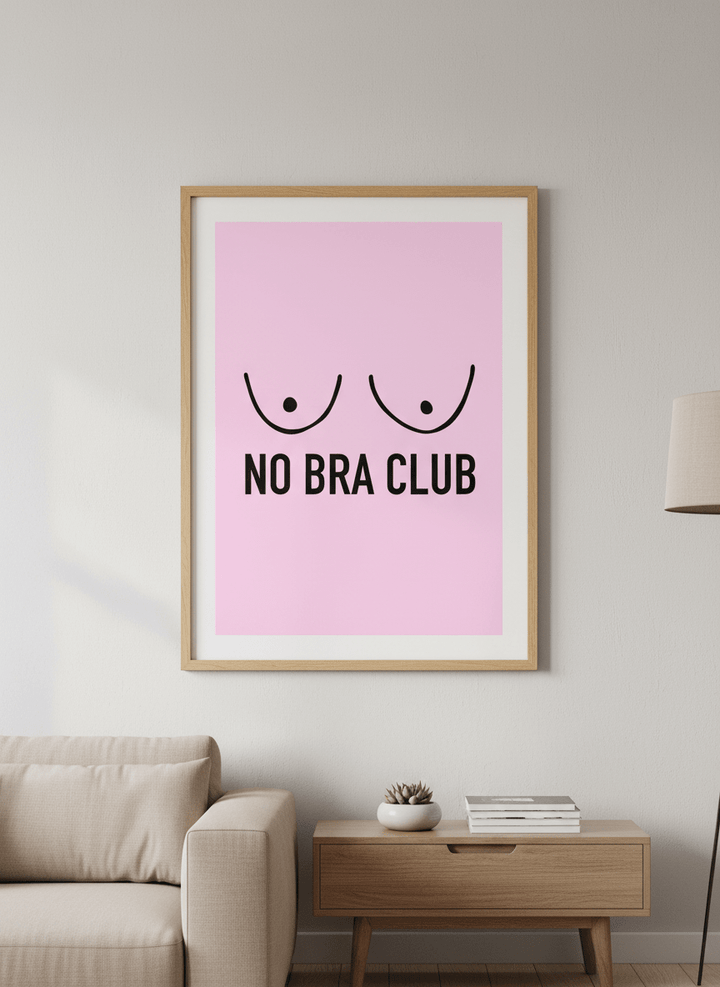 Modern wall art styled above a sofa in a neutral living room