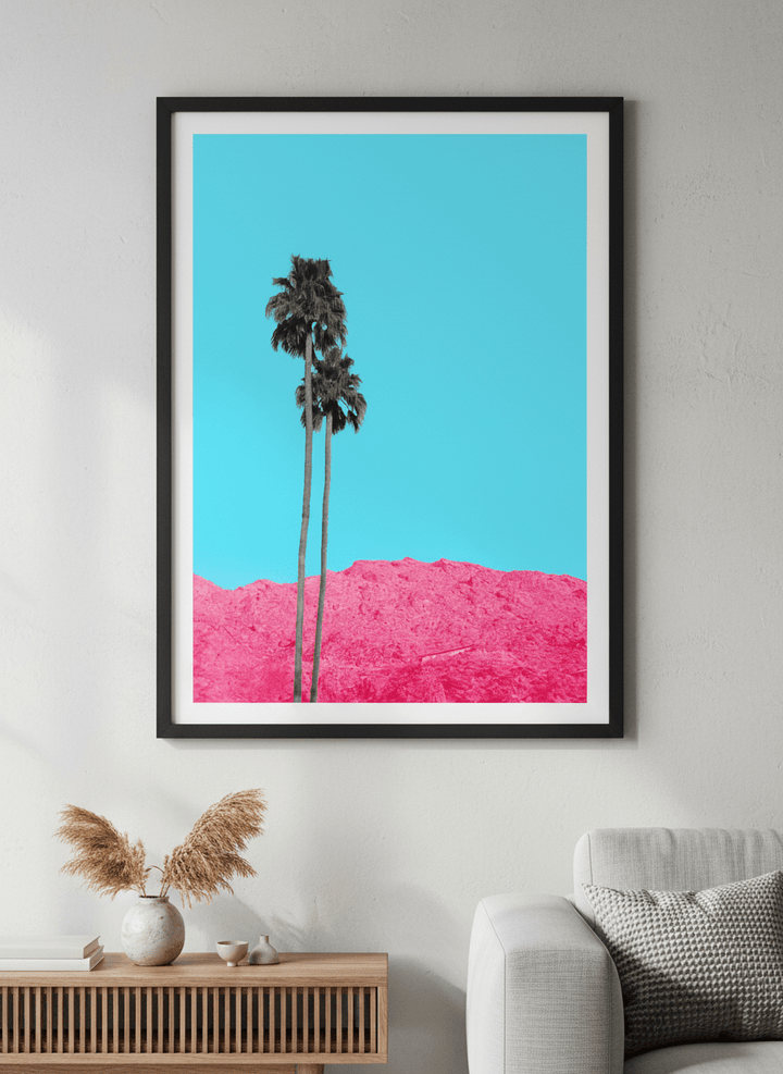 Modern wall art styled above a sofa in a neutral living room