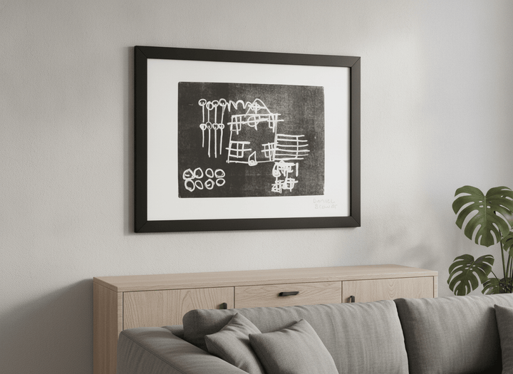 Modern wall art styled above a sofa in a neutral living room