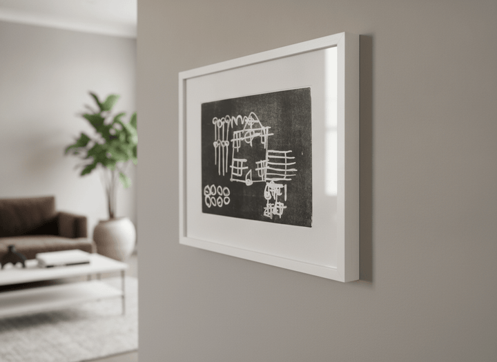 Modern wall art styled above a sofa in a neutral living room