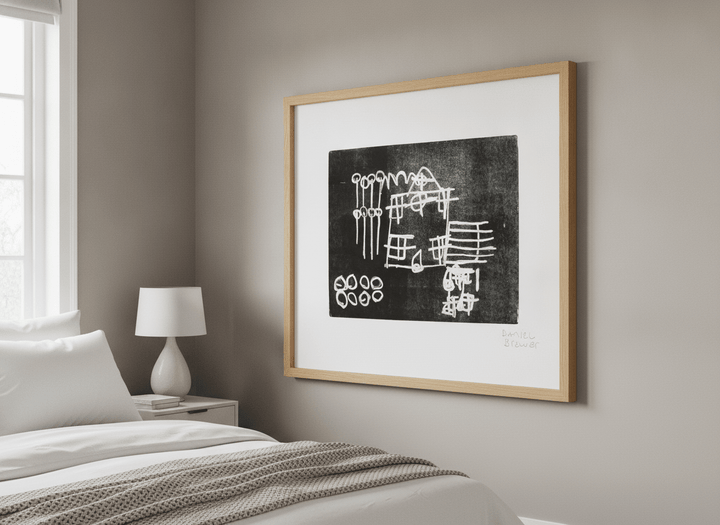 Minimalist artwork displayed in a calm, light-filled bedroom interior