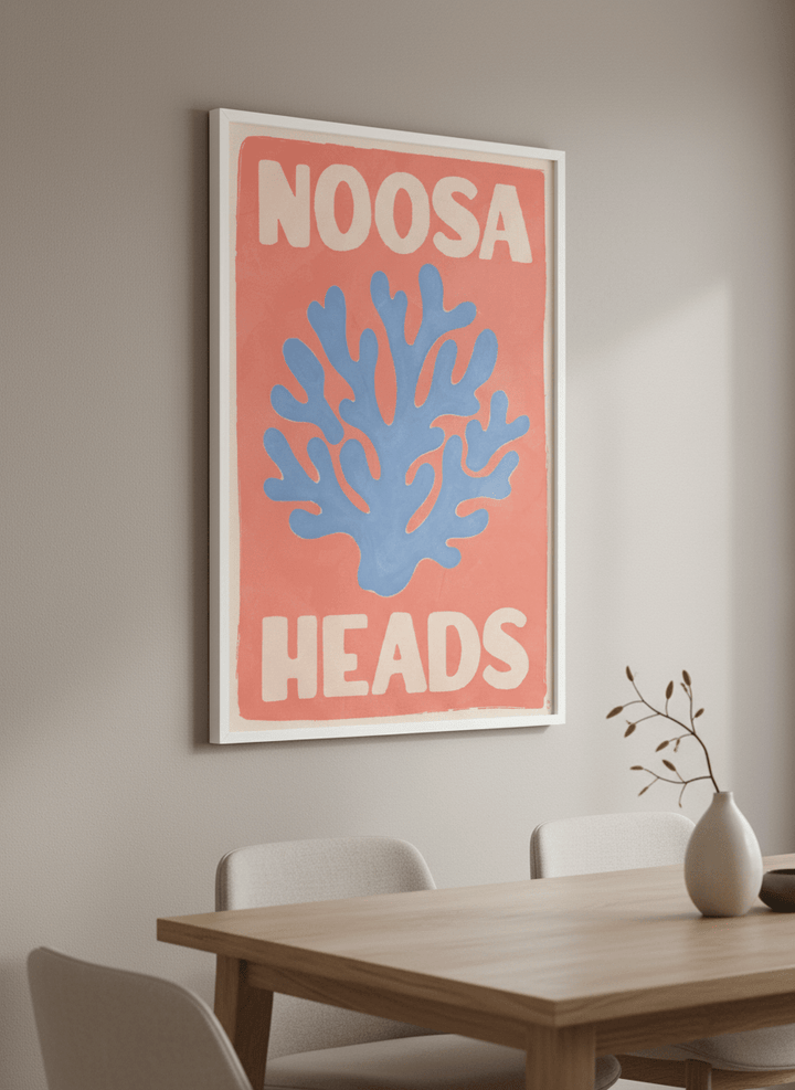 Wall art styled above a dining table in a contemporary home