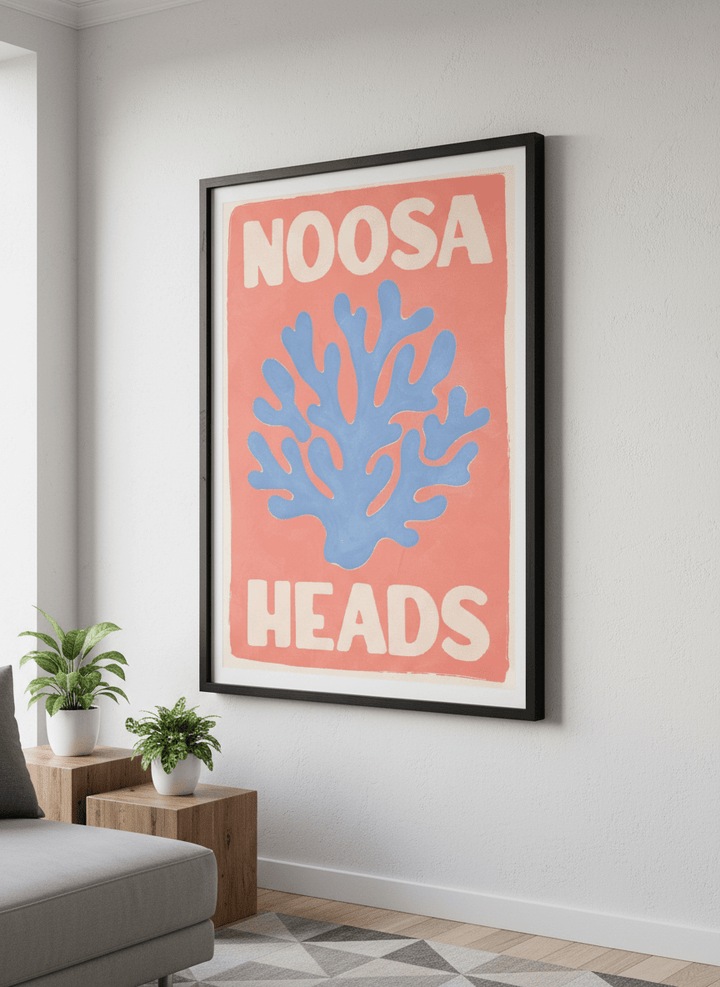 Modern wall art styled above a sofa in a neutral living room