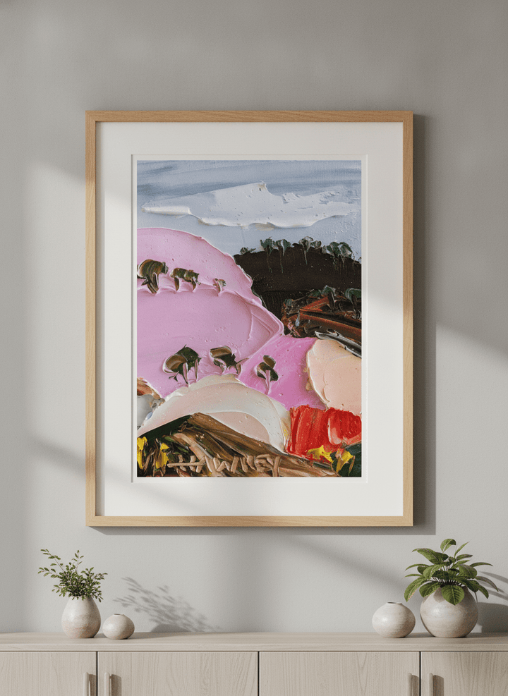 Modern wall art styled above a sofa in a neutral living room
