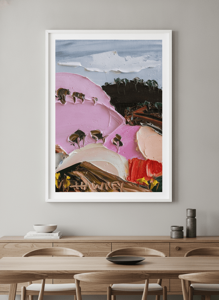 Wall art styled above a dining table in a contemporary home