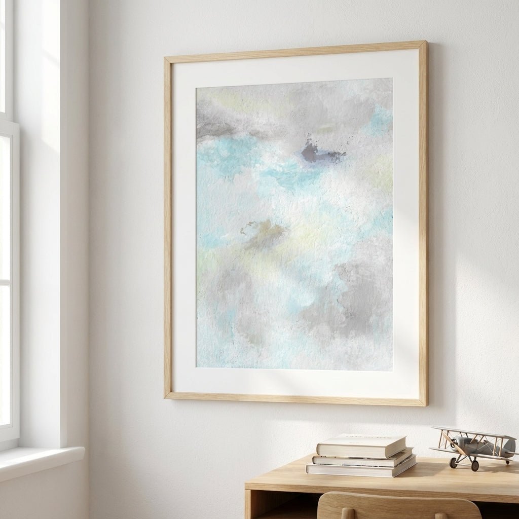 abstract artwork on a wall above a desk with books and decor.