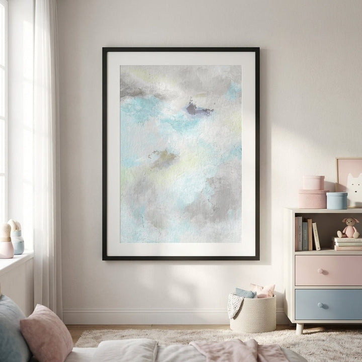 abstract artwork on a wall in a room with a bookshelf and decor items.