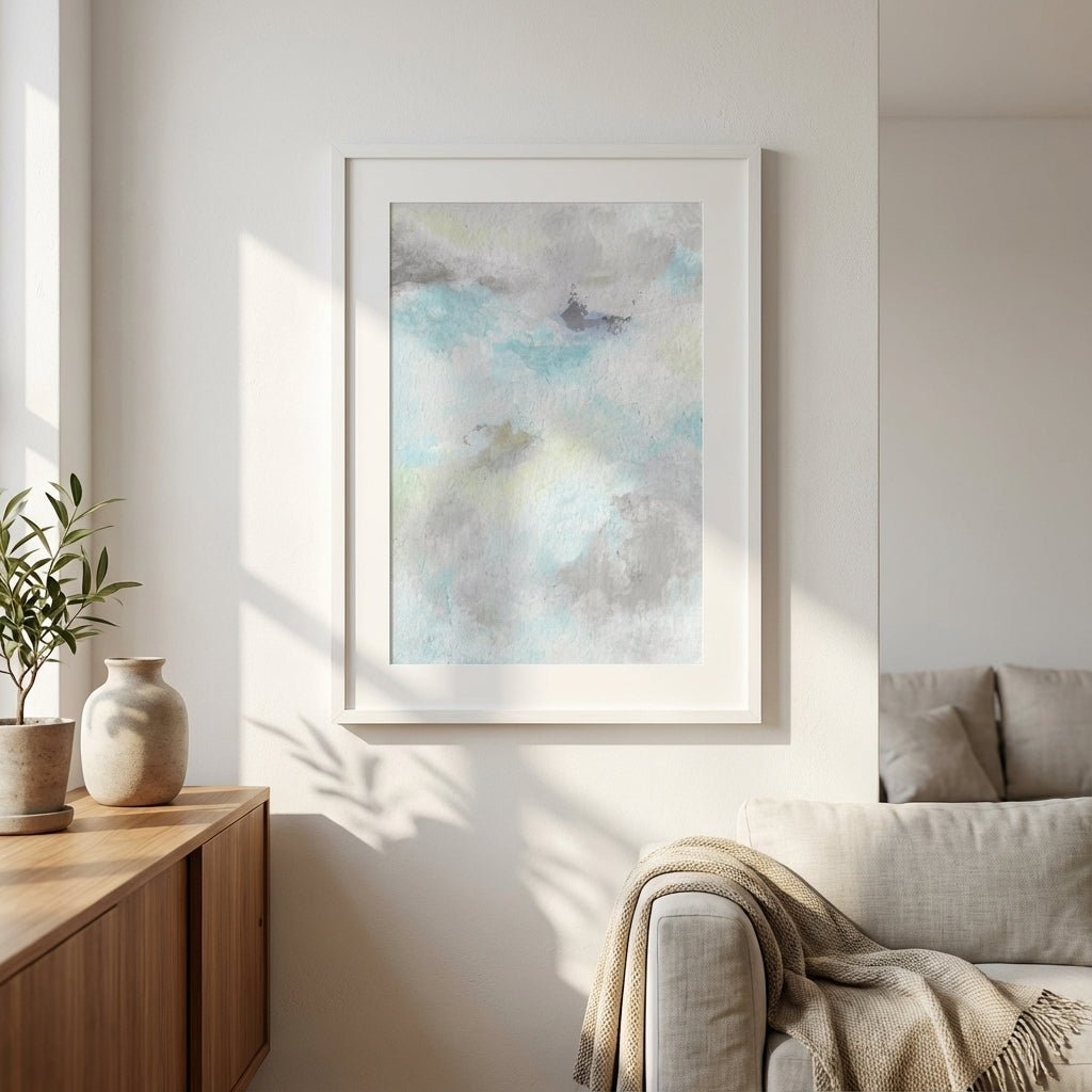 abstract artwork on a wall in a living room with a couch and side table.