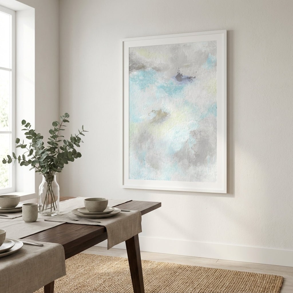 Dining room with a wooden table set for a meal, a vase with greenery, and abstract painting on the wall.