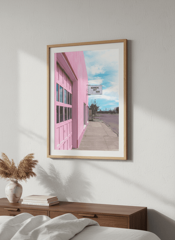 Minimalist artwork displayed in a calm, light-filled bedroom interior
