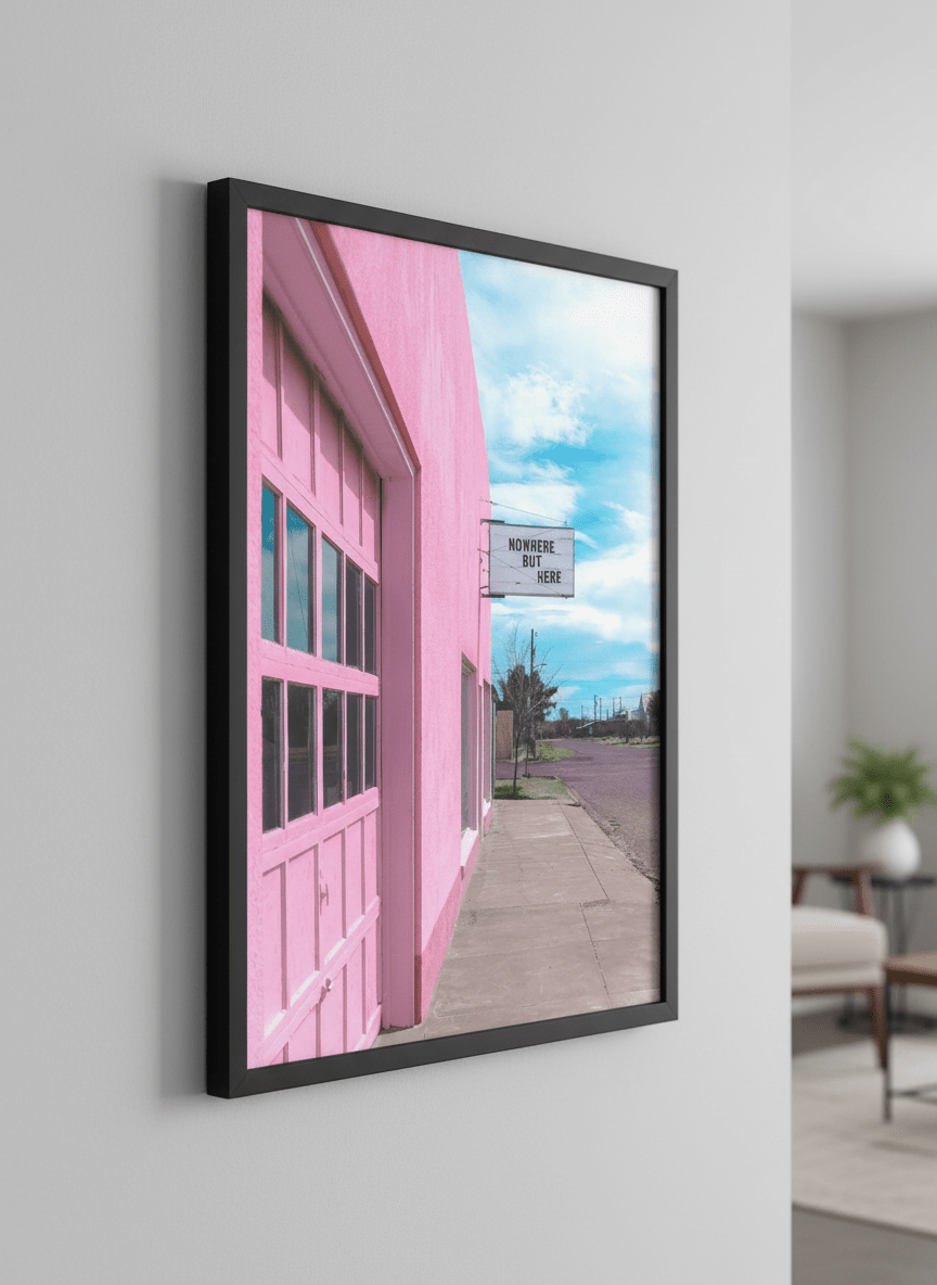 Modern wall art styled above a sofa in a neutral living room