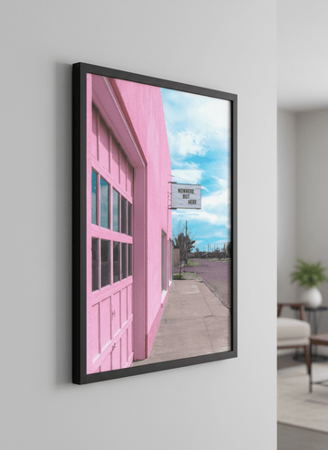 Modern wall art styled above a sofa in a neutral living room