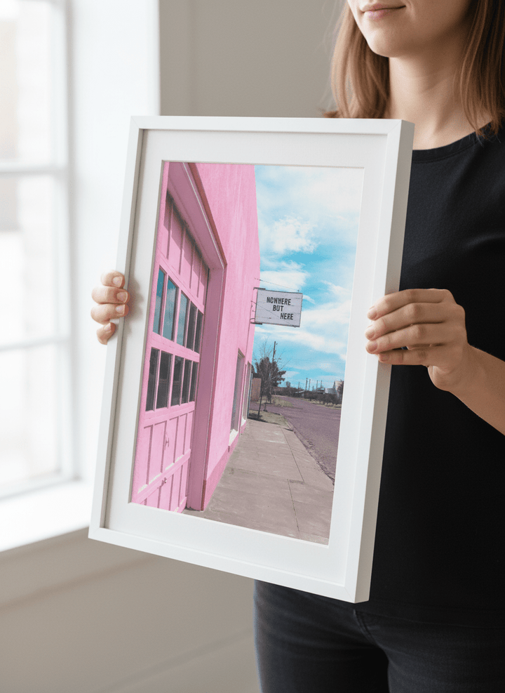 Person showcasing the artwork against a clean modern interior wall