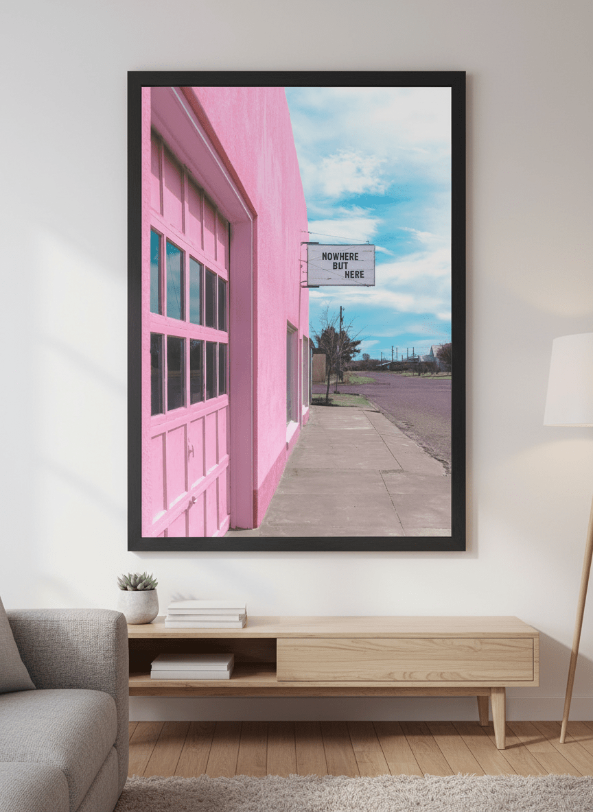 Modern wall art styled above a sofa in a neutral living room