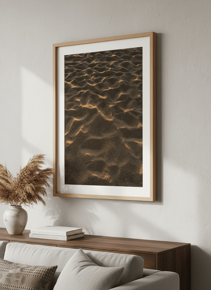Modern wall art styled above a sofa in a neutral living room