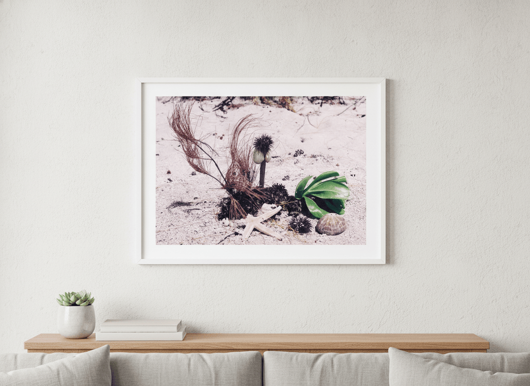 Modern wall art styled above a sofa in a neutral living room