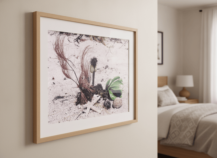 Minimalist artwork displayed in a calm, light-filled bedroom interior