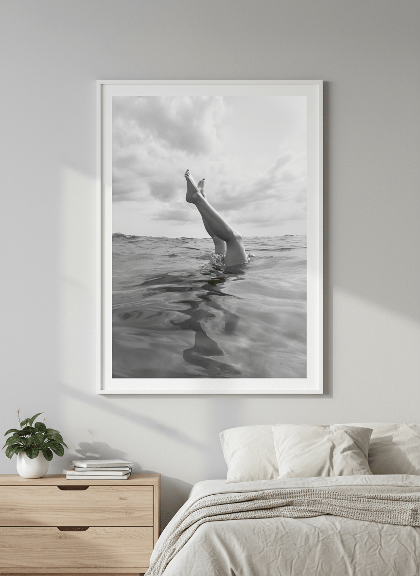 Minimalist artwork displayed in a calm, light-filled bedroom interior