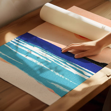 artwork unrolled on wooden floor