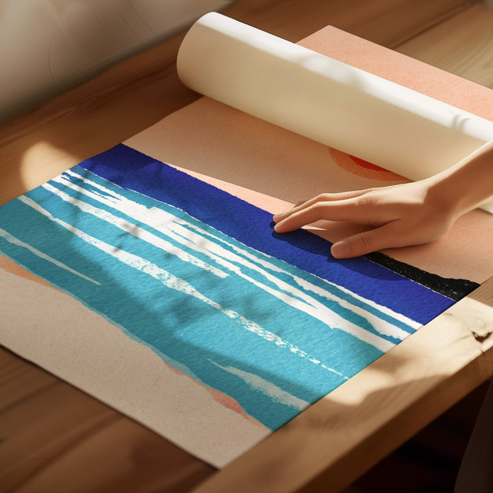 artwork unrolled on wooden floor