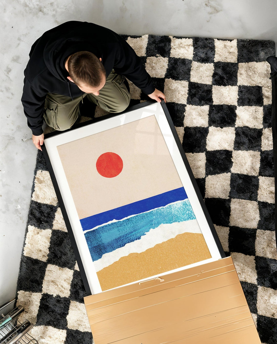unboxing ocean artwork on checkered rug