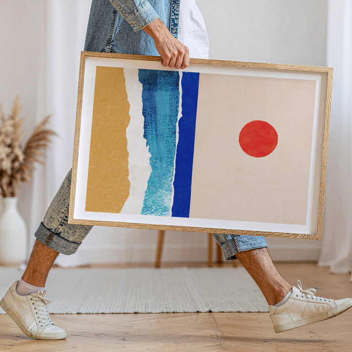 person walking holding artwork