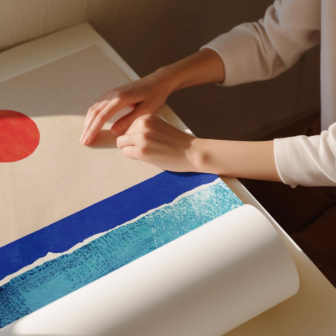 artwork unrolled on white table