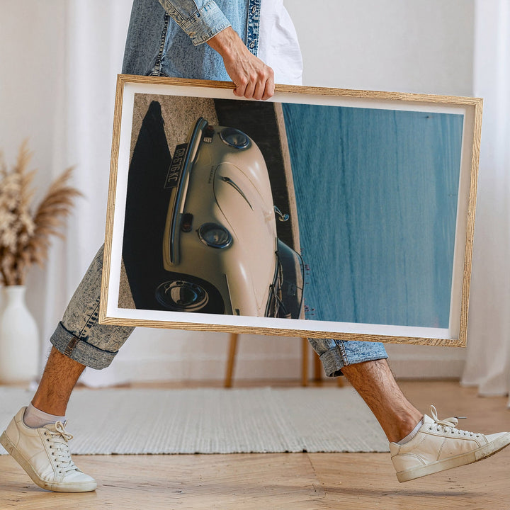 person walking holding a photo