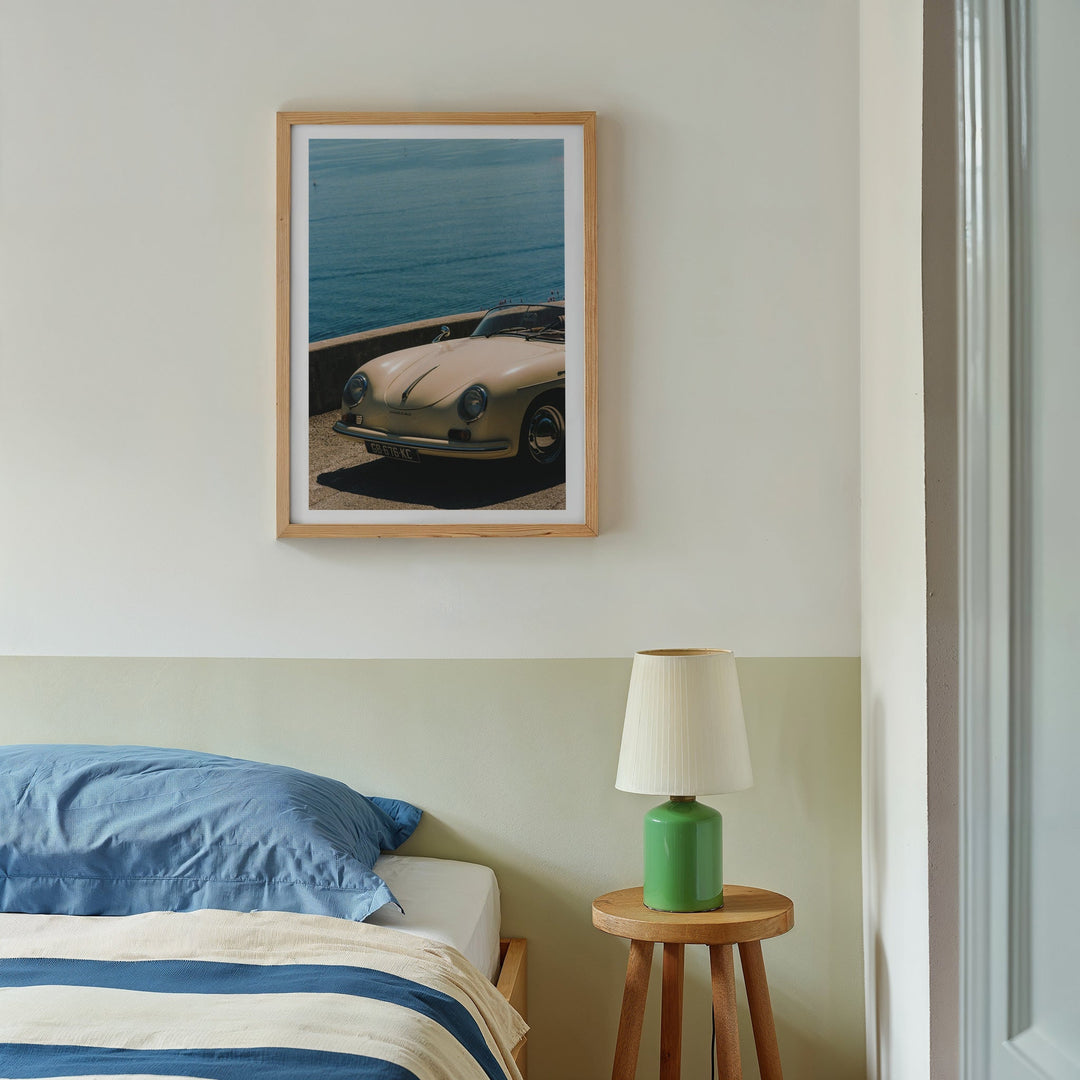 photo of white car hanged above bed with bedside lamp