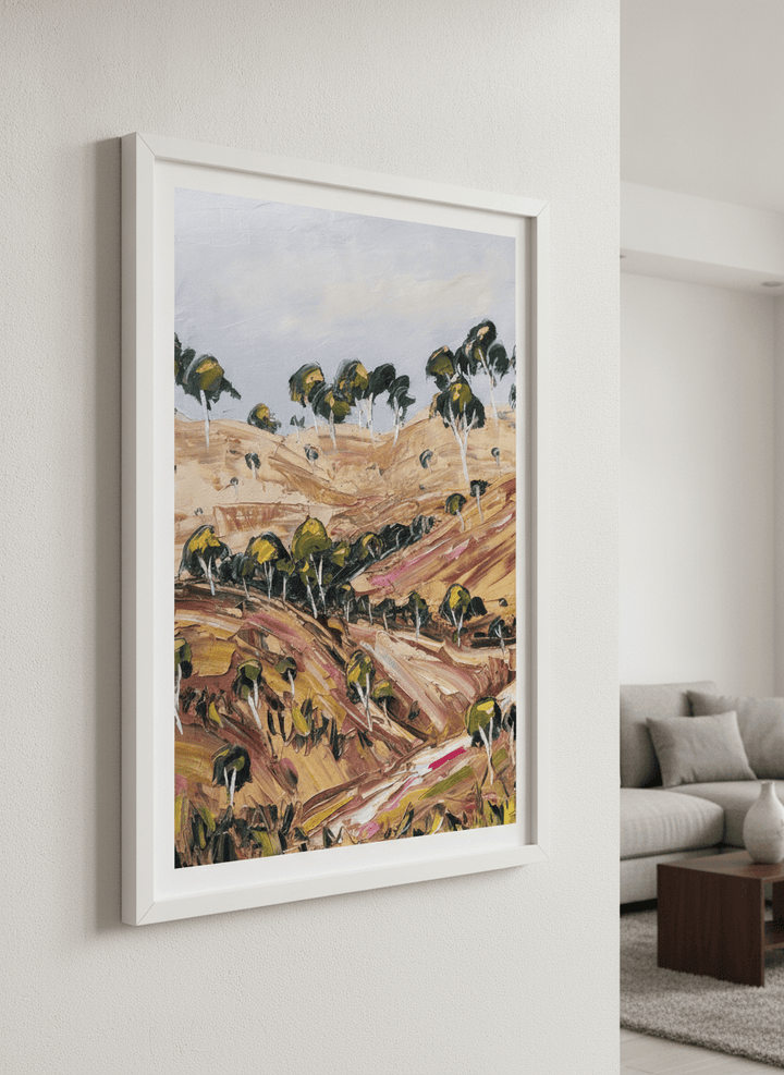Modern wall art styled above a sofa in a neutral living room